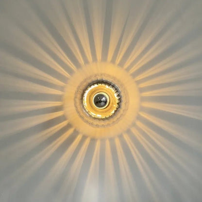 Wandlamp Art Deco met Gedraaid Glazen Bol en Zonnestraal Lichteffect